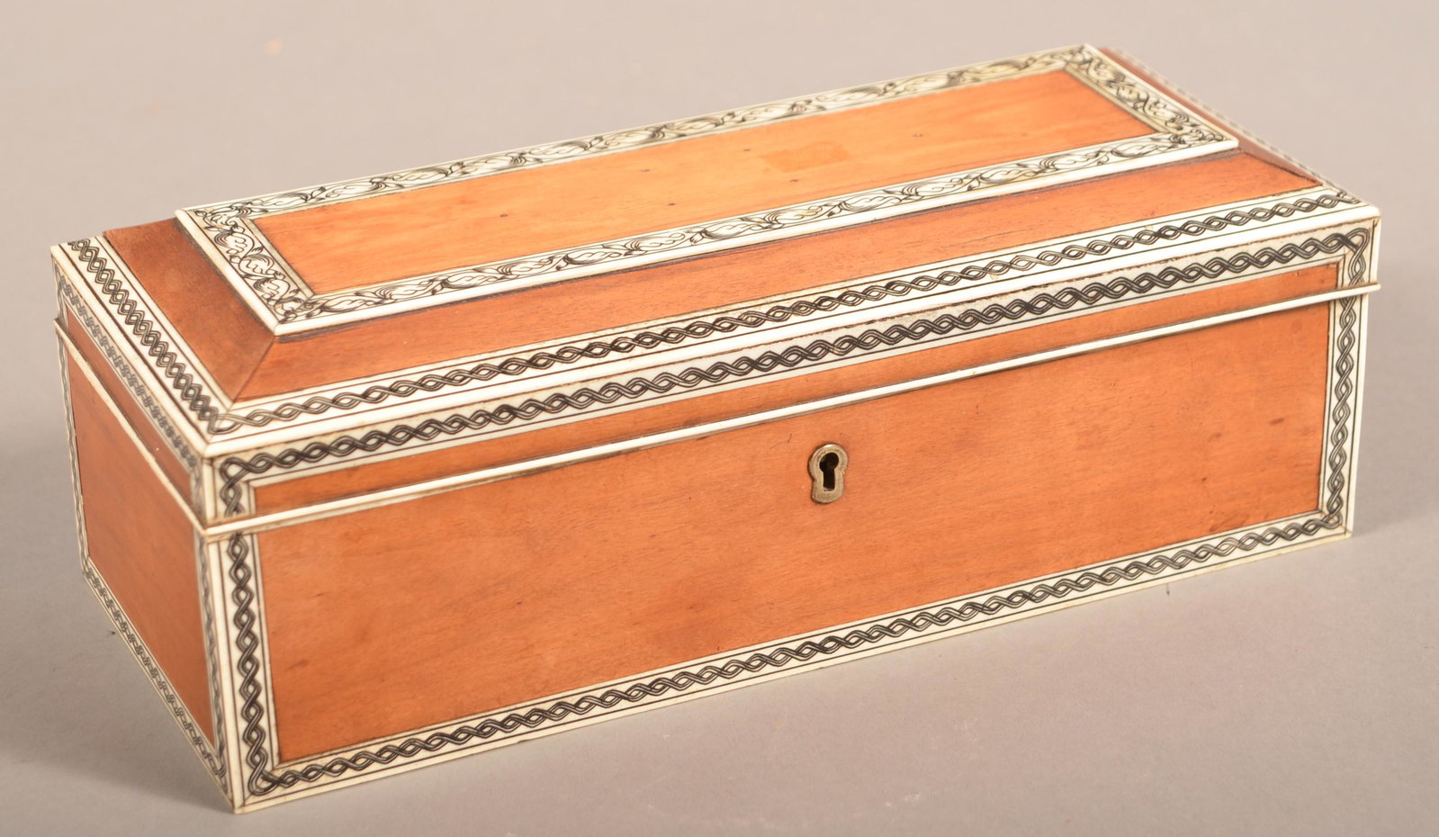 Antique Bone Inlaid Mahogany Ribbon Box.: Antique Bone Inlaid Mahogany Ribbon Box. 3-3/4"h. x 10"w. x 4-1/4"d.Condition: Good with wear and loss.