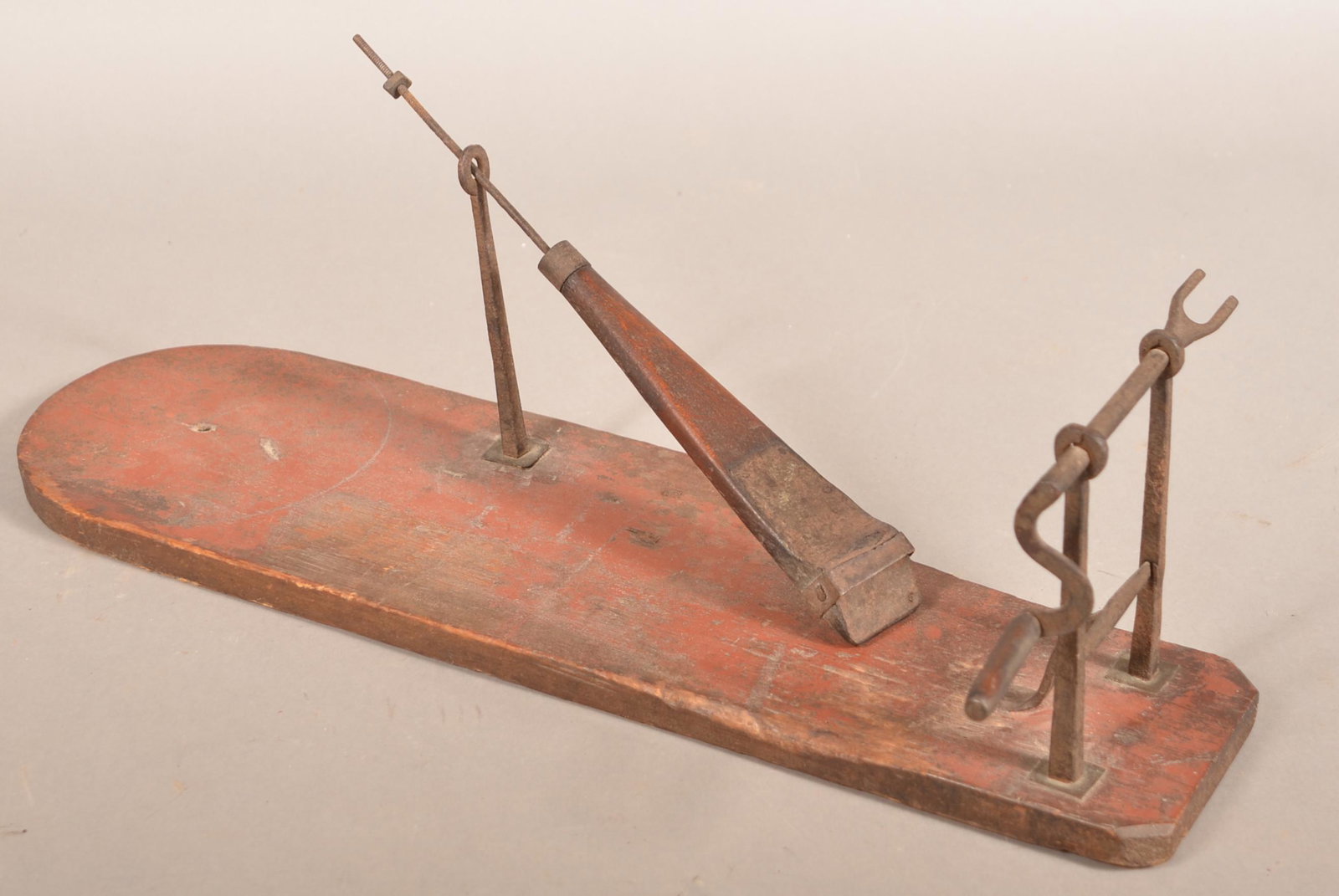 19th Century Wood and Iron Apple Peeler.: 19th Century Wood and Iron Apple Peeler. Crank action with plank base. 22"l. overall. Condition: Good with use wear.