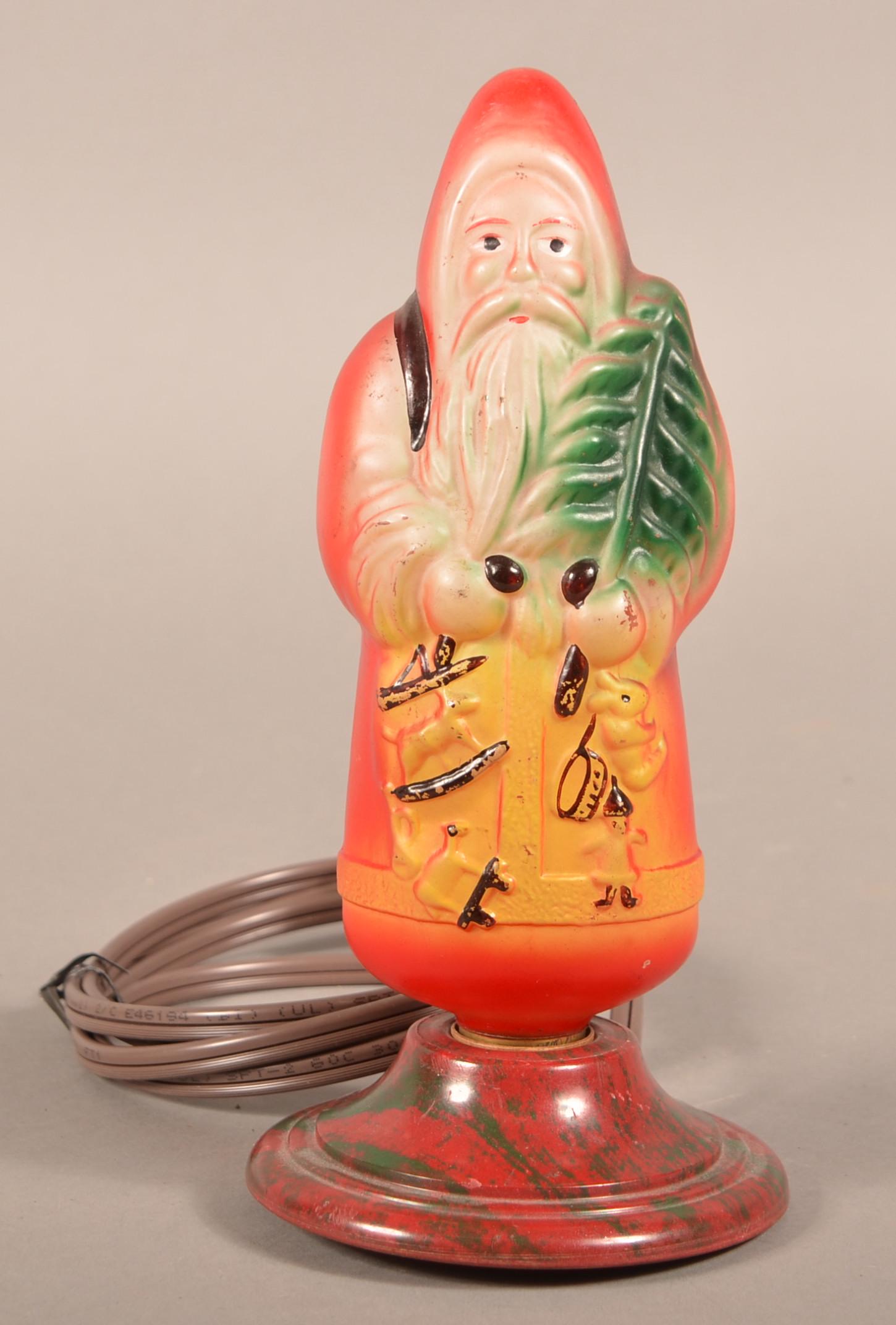 Vintage Molded & Painted Santa Claus Light Bulb.: Vintage Molded & Painted Santa Claus Light Bulb. In the original plastic base. Unmarked. 9-1/4"h. Condition: Very good, working condition. Wiring not to code.