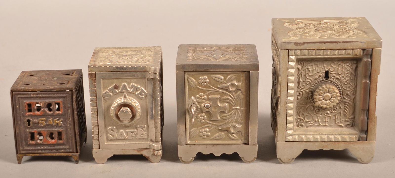 Four Antique/Vintage Cast Iron Safe Still Banks. (1 of 4)
