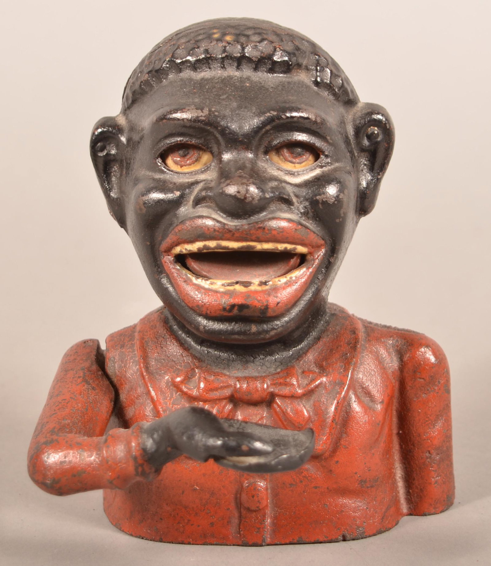 Jolly Negro Cast Iron Mechanical Bank.: Jolly Negro Cast Iron Mechanical Bank. 6-1/4"h. Condition: Good with wear. Replacement metal base plate.