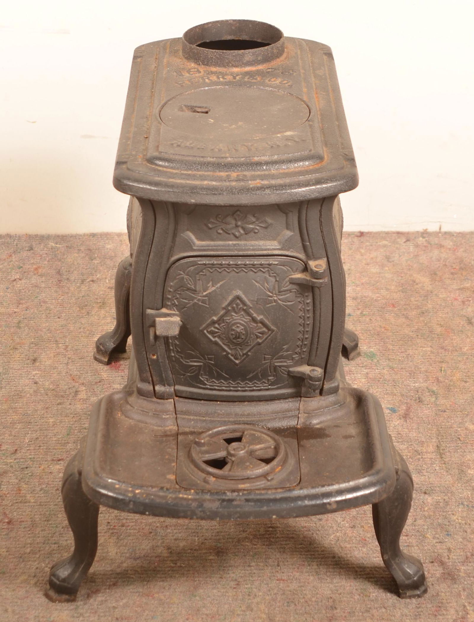 Perry & Co. Albany, NY Cast Iron Stove.: Perry & Co. Albany, NY Cast Iron Stove. 20-1/2"h. 15"w. x 26"d. Condition: Good with rust and pitting.