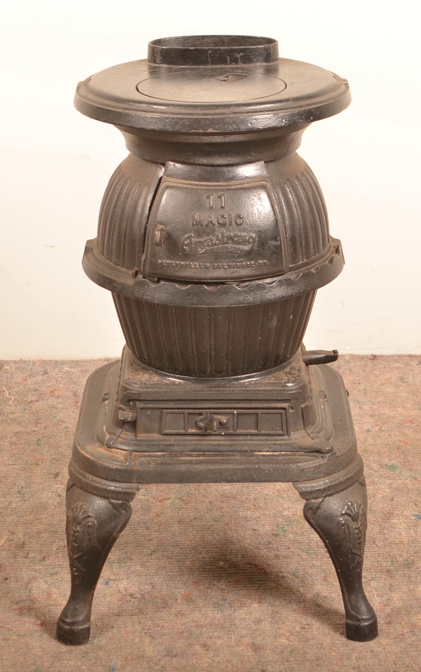 New York Stove Works Peekskill, NY Cast Iron Stove.: New York Stove Works Peekskill, NY Cast Iron Stove. 25-1/2"h. 15"w. x 15-1/2"d. Condition: Good with rust and pitting.