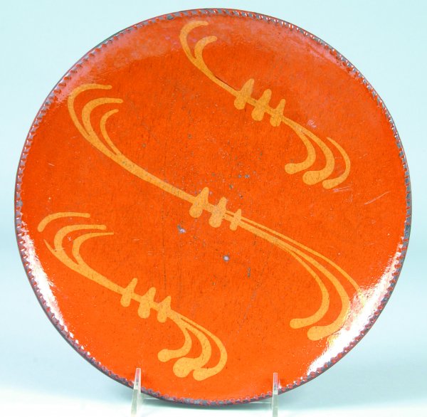 Greg Shooner 2004 Redware Slip Decorated Plate havi: Greg Shooner 2004 Redware Slip Decorated Plate having music note styled decorations, coggle rim, 11"dia., (good condition).