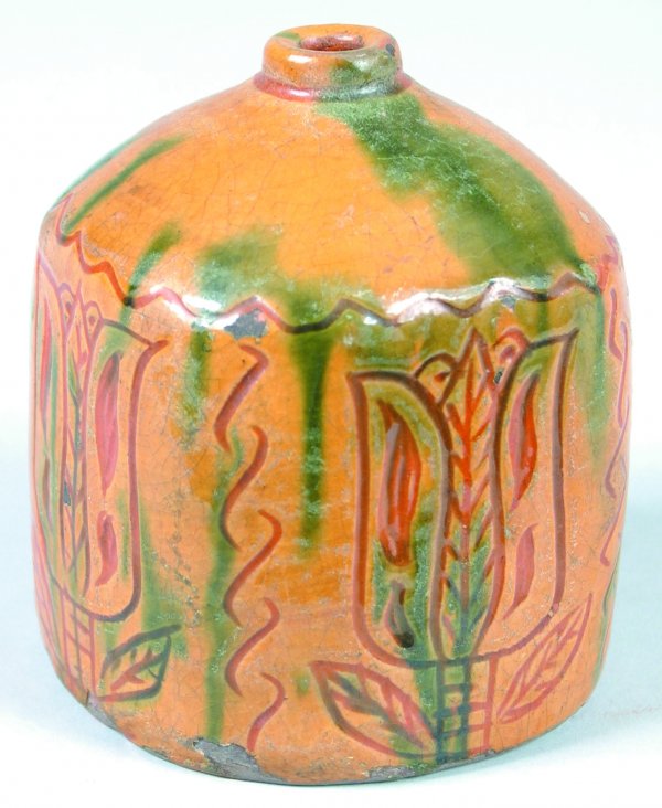 Greg Shooner 2001 Redware Ink Bottle or Bud Vase ha: Greg Shooner 2001 Redware Ink Bottle or Bud Vase having sgraffito tulip decorations, 4"h., (good condition with intentional wear chips).