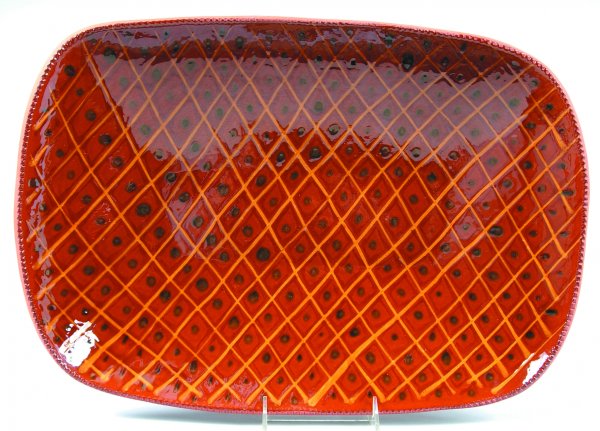 C. N. Foltz 1985 Redware Slip Decorated Loaf Dish h: C. N. Foltz 1985 Redware Slip Decorated Loaf Dish having lattice style design with dot decorations, coggle rim, 13-1/4"x 19"dia., (very good condition).