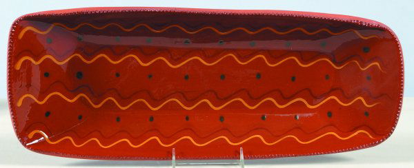 1985 C. N. Foltz Redware slip Decorated Loaf Dish,: 1985 C. N. Foltz Redware slip Decorated Loaf Dish, oblong form with muti-colored wavy line and dot decorations, coggle rim, 2-3/8"h.x21-3/8"dia.x8-3/8"., (very good condition).