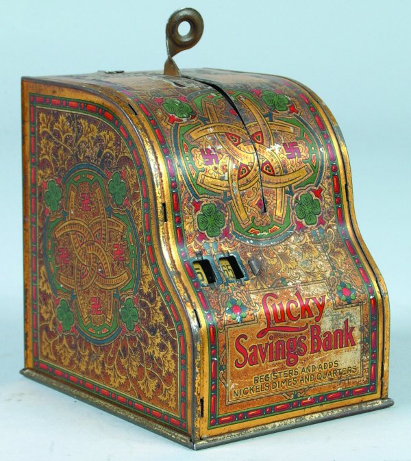 Tin Lithograph Lucky Savings Bank manufactured by : Tin Lithograph Lucky Savings Bank manufactured by American Can Co. with a patented dated of 1916 on back of bank, bank registers and adds coins and also has a bell that rings to signal amount of money