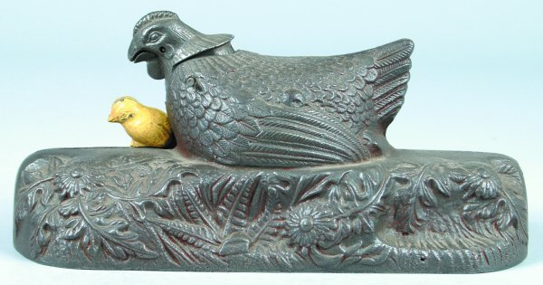 Hen and Chick Cast Iron Mechanical Bank. This bank: Hen and Chick Cast Iron Mechanical Bank. This bank was assembled from original parts that were obtained at the J. E. Stevens Factory auction. Overall good casting and operation, bank has very little p