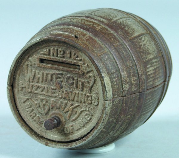 Cast Iron White City No. 1 Puzzle Safe Still Bank : Cast Iron White City No. 1 Puzzle Safe Still Bank manufactured by Nicole and Co., overall good condition with wear and rusting to plated surface, missing much of paper label on bottom, 3-7/8" h.