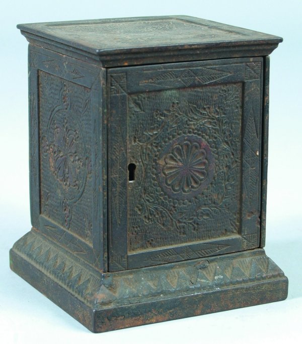 Cast Iron Geometric Design Still Bank with key man: Cast Iron Geometric Design Still Bank with key manufactured by Rex Keyser Co., overall good condition with various paint loss, surface rust and wear, 5-1/2" h.