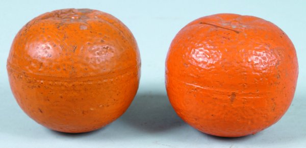 Two Earthenware Pottery Oranges, 3" h. overall, ba: Two Earthenware Pottery Oranges, 3" h. overall, banks are in fair to good condition with paint loss and discoloration throughout banks, banks have various surface cracks from firing.