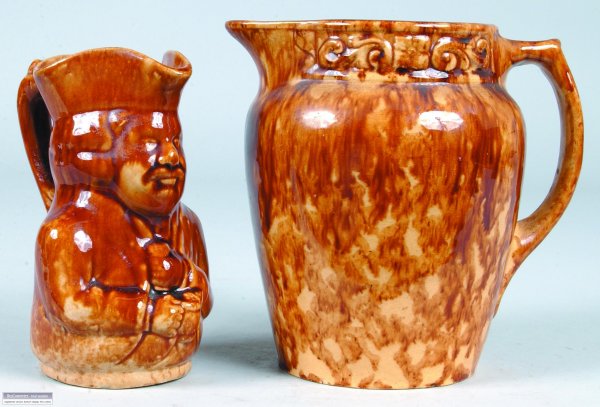 Two Yellow ware Pitchers with Rockingham glaze, fi