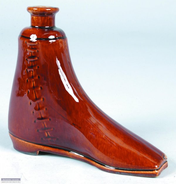 Earthenware Boot form Flask with brown Rockingham 