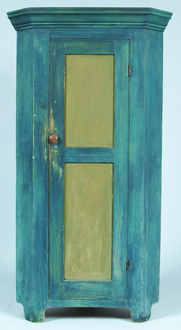 Small Softwood Single Part Blind Door Corner Cupbo: Small Softwood Single Part Blind Door Corner Cupboard. Molded cornice, double paneled door, interior shelves, cut-out feet with later blue and green paint. Condition: Normal wear. 61"h x 32 ½"w x 20"