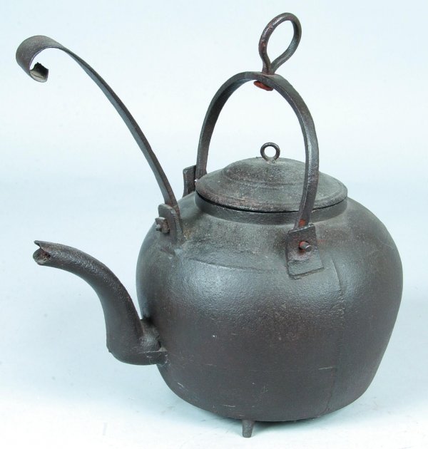 L. Shaw Cast Iron Tea Kettle with Tiller, signed L: L. Shaw Cast Iron Tea Kettle with Tiller, signed L. Shaw, round form with gooseneck spout, bail swing handle with loop hanging hook, tiller with scroll terminal, 14-1/4"h.