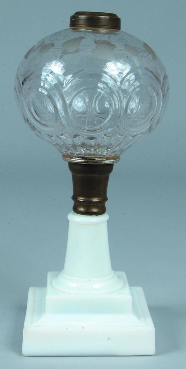 Colorless Glass "Bullseye Band Entwined" Oil Lamp wi: Colorless Glass "Bullseye Band Entwined" Oil Lamp with berry and ivy vine copper wheel engraving on font and opaque white stepped pedestal base. No burner or shade. 11 ½"h. Minor chips.