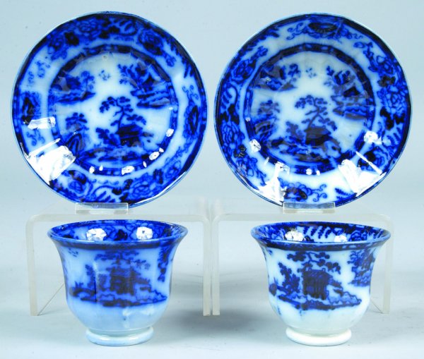 Two Flow Blue China Hong Kong pattern Handleless C: Two Flow Blue China Hong Kong pattern Handleless Cups and Saucers attributed to C. Meigh. One saucer with pin-nip on edge.