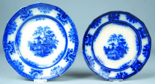 Two Flow Blue China Amoy pattern Paneled Plates by: Two Flow Blue China Amoy pattern Paneled Plates by Davenport. 9 ½"diam. with edge chips and 8 ½"diam. chips on base rim.