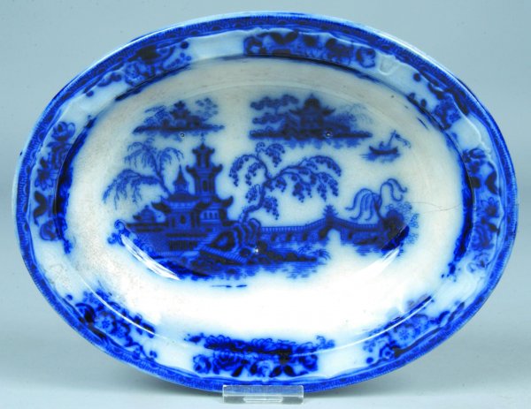 Flow Blue China Pelew pattern Oval Open Vegetable: Flow Blue China Pelew pattern Oval Open Vegetable Bowl by E. Challinor, 9 ½"l. x 7"w. 2 ½" crack and some discoloration.