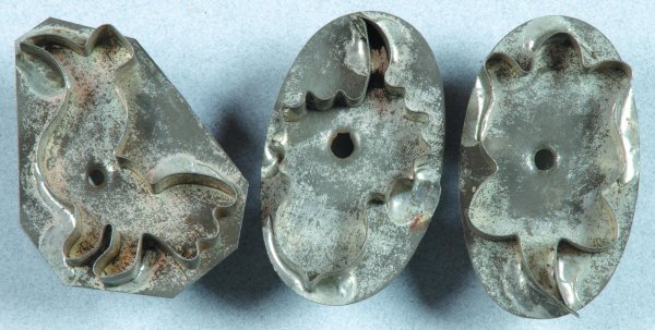 Three Various Miniature 19th Century Tin Cookie Cu: Three Various Miniature 19th Century Tin Cookie Cutters stamped England; Bird, acorn and flower, soldered to perforated foundations with handles soldered to back. Condition: minor rust. 2 ½"h.