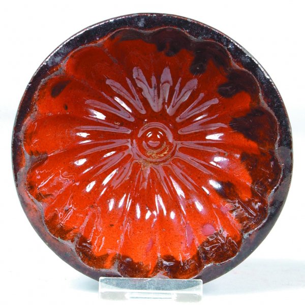 Small Redware Food Mold with floral design interio: Small Redware Food Mold with floral design interior, mottled glaze, 1-3/4"h. x 4-1/4"dia., (good condition with minor rim chips).