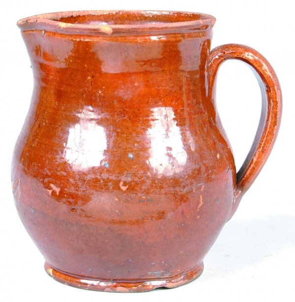 Redware Bulbous Form Cream Pitcher, orange/brown g: Redware Bulbous Form Cream Pitcher, orange/brown glaze, applied handle, 4-3/4"h. (chips).