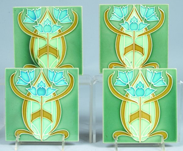Four Art Nouveau Pottery Tiles by Minton, Hollins : Four Art Nouveau Pottery Tiles by Minton, Hollins & Co. Each tile measures 5-7/8" square, green, blue and tan glazing with floral motif. Cast on back in raised letters "MINTON, HOLLINS & CO, PATENT TI