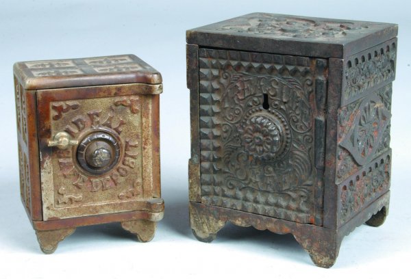 Two Cast Iron Safe Form Still Banks: first is mark: Two Cast Iron Safe Form Still Banks: first is marked" Ideal Safe Deposit" with combination lock, 4-1/4"h., second is J & E Stevens marked Treasure Safe with combination lock (broken), 5"h. (overall go
