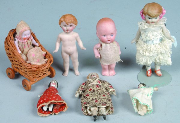 Seven Miniature Bisque and Porcelain Dolls, one ma