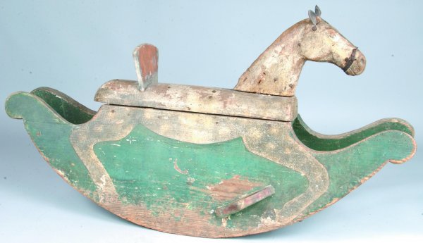 19th Century Rocking Horse, polychrome painted wit: 19th Century Rocking Horse, polychrome painted with cheese cutter rockers with foot rest, half rounded body and head leather ears, 22"h. x 42-3/4"l., (fair condition with restoration).