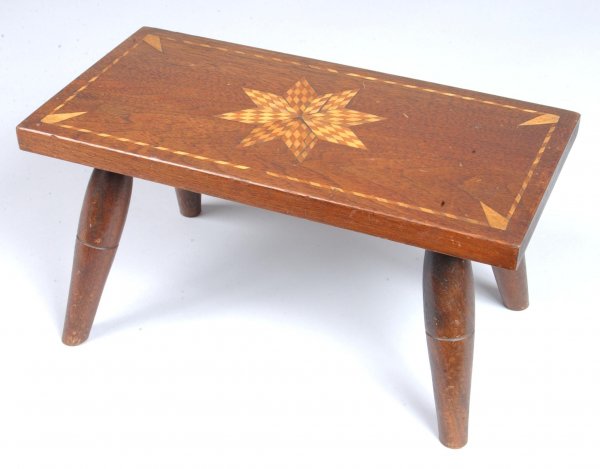 Inlaid Walnut Footstool signed J.H. Kurts. Central: Inlaid Walnut Footstool signed J.H. Kurts. Central eight pointed star with checkered inlay, bordered by checkered line inlay, beveled plank top and turned splayed legs. Condition: Small repair to top 