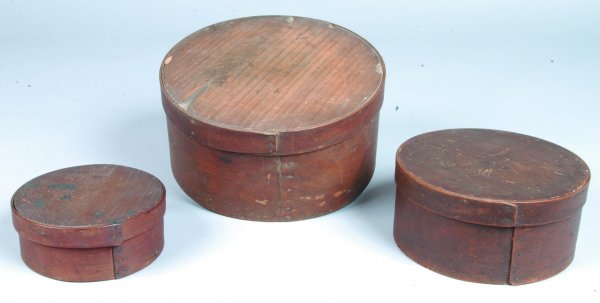 Assembled Set of Three Graduated Pantry Boxes with: Assembled Set of Three Graduated Pantry Boxes with tacked straight seam lap joints and natural finish. Condition: Some cracks and losses. Largest box measures 5"h x 10"diam.