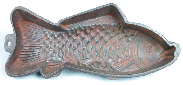 Cast Iron Fish Form Food Mold with embossed fish d: Cast Iron Fish Form Food Mold with embossed fish design, three legs and hanging hole, 2-1/4"h. x 13-1/2"l. x 6"d., (good condition).