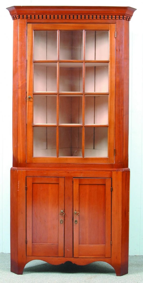 Pennsylvania Cherry Two Part Corner Cupboard with : Pennsylvania Cherry Two Part Corner Cupboard with cove and dentil molded cornice, single 12 pane glazed upper door, two lower paneled doors and scalloped cut-out base. 87"h x 42"w x 24"d. Condition: R