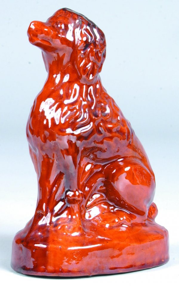 Ray E. Lear Waynesboro, Pa. Redware Seated Poodle: Ray E. Lear Waynesboro, Pa. Redware Seated Poodle Figure, full body of seated poodle with mottled glaze, 6 ½"h. (good condition).