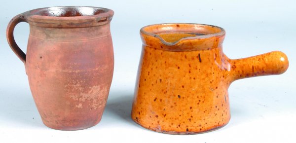 Two Redware Pieces, 1st is Apple Butter Storage Cr: Two Redware Pieces, 1st is Apple Butter Storage Crock with interior glazed, 7"h. (interior with pitting). 2nd is a Handled Pot with speckle glaze, 5 ¾"h. (missing lid and spout and base with chip).