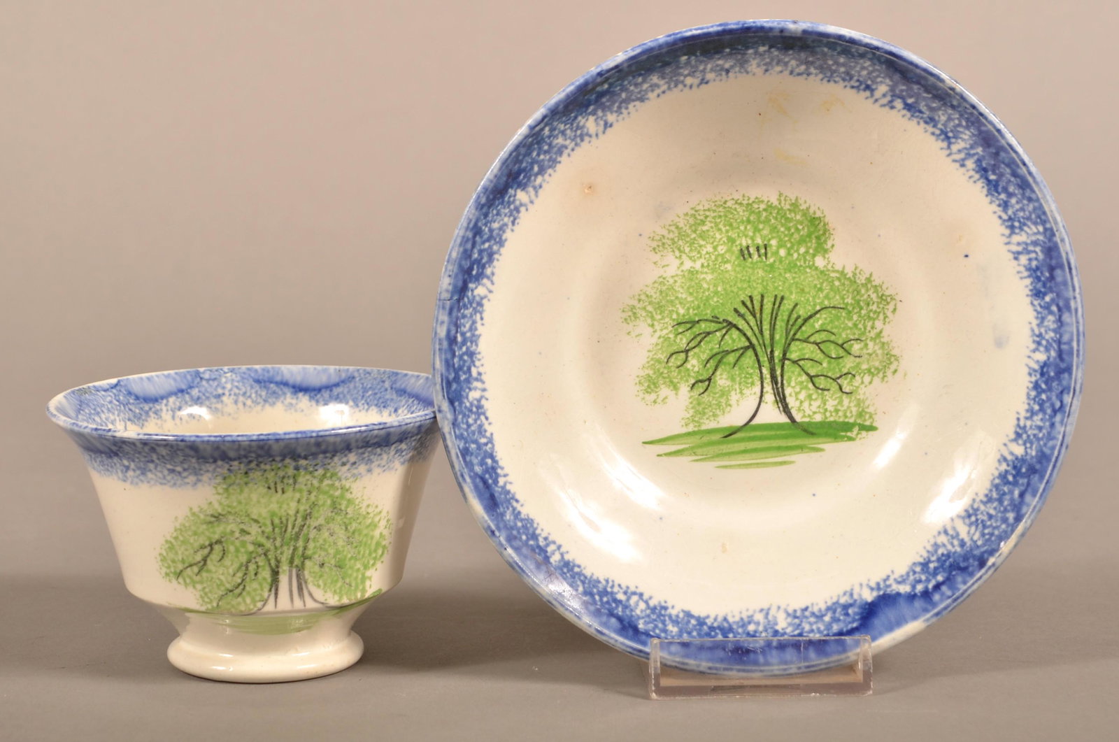 Blue Spatter China Tree Pattern Cup and Saucer.: Blue Spatter China Tree Pattern Cup and Saucer. Saucer measures 6" diam. Condition: Very good.