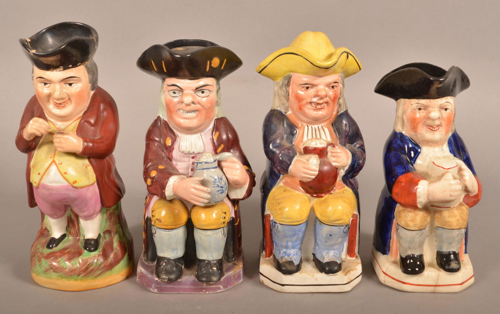 Four Staffordshire China Hand Painted Toby Jugs. (1 of 4)
