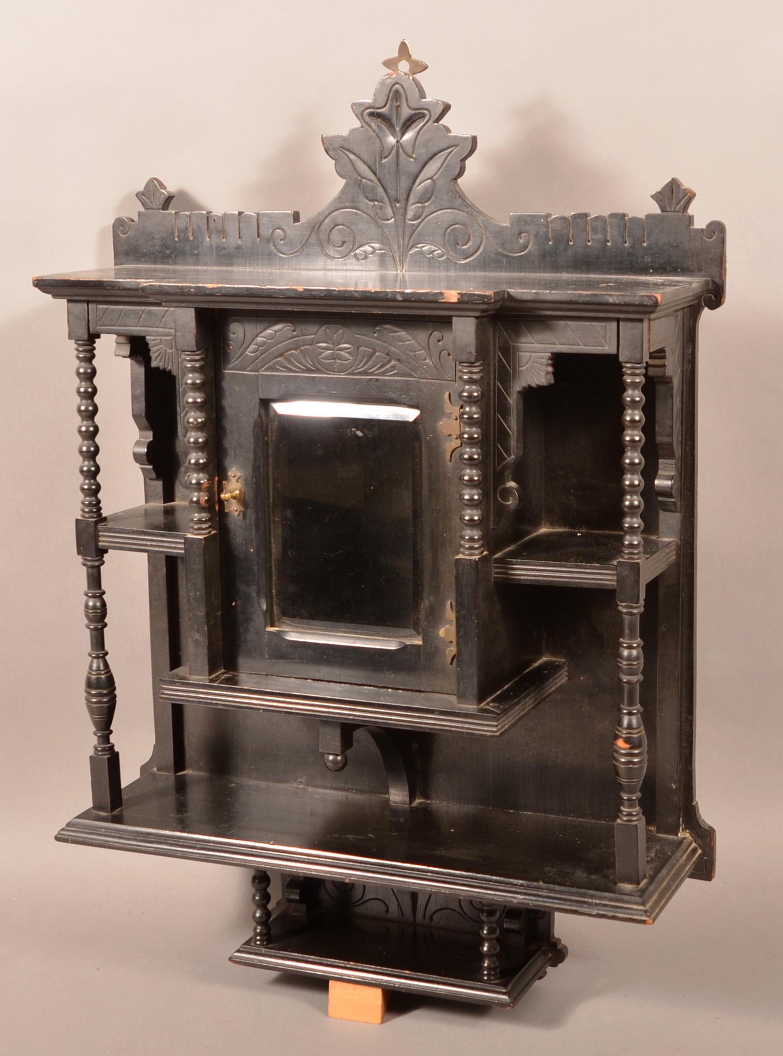 Eastlake Victorian Carved and Molded Wall Shelf.: Eastlake Victorian Carved and Molded Wall Shelf. Ebony finish. 31"h. x 22"w. x 6-1/2"d. Condition Good with wear.