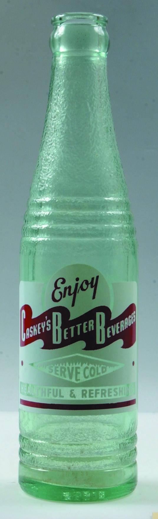 Caskey's Better Beverages clear crown top soda bott: Caskey's Better Beverages clear crown top soda bottle, red and white, bottled by Amos J. Caskey, Bart, Lancaster County, Pa.8.75", Condition: Good.