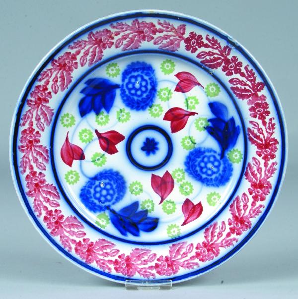 Cut-sponge with Flow Blue Ironstone China 9 ¼" Pla: Cut-sponge with Flow Blue Ironstone China 9 ¼" Plate with Floral and foliate decoration and central Bull's eye design. Condition: Good.