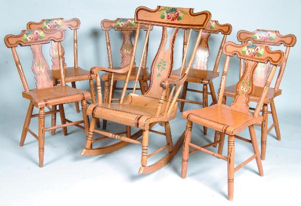 Set of Six Paint Decorated Plank-seat Splat-back S: Set of Six Paint Decorated Plank-seat Splat-back Side Chairs and a Matching Boot-jack back Rocking Chair. Tan ground with polychrome floral and foliate decoration. Three side chairs and rocker signed 