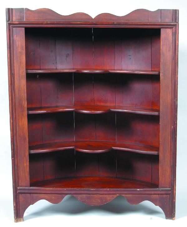 Softwood Barrel-back Open Corner Cupboard. Scallop: Softwood Barrel-back Open Corner Cupboard. Scalloped cornice, butterfly shelves, molded stiles and scalloped base. 52"h x 48"w x 18"d. Condition: Refinished and normal wear.