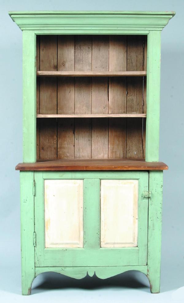 20th Century Country Softwood Step-back Cupboard w: 20th Century Country Softwood Step-back Cupboard with Robin egg blue and white paint. Ogee molded cornice, open shelves, single door with double raised panels and scalloped skirt with Cut-out feet. 77