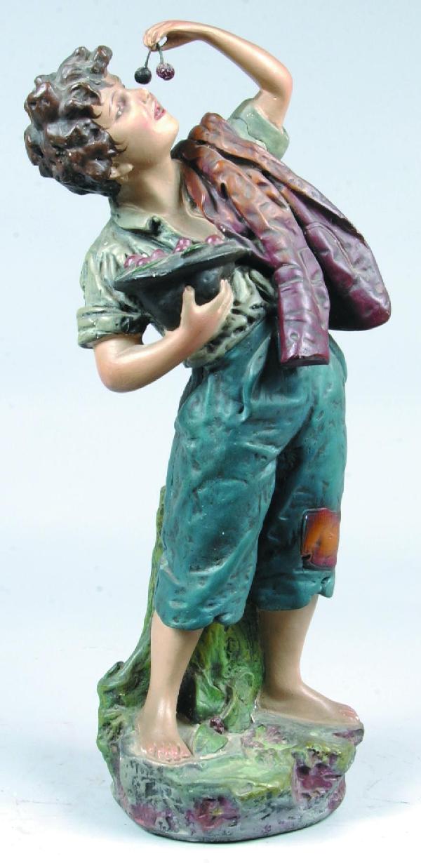Plaster of Paris Cherry Boy Sculpture, boy holding: Plaster of Paris Cherry Boy Sculpture, boy holding hat full of cherries in right arm, left arm is raise to take a bite out of cherries, left arm is molded separate, 25"h. Condition: Good with minor im