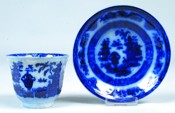 Flow Blue Ironstone China "Temple" Handleless Cup: Flow Blue Ironstone China "Temple" Handleless Cup and Saucer marked Podmore, Walker Co. Condition: Good.