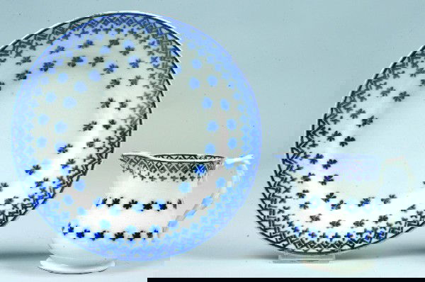 Two Pieces of Flow Blue Snowflake Pattern Ironston: Two Pieces of Flow Blue Snowflake Pattern Ironstone China; 8 ¾" plate (good) and a 4 ¼" bulbous cream pitcher with mulberry rim, (glazing rub at spout).