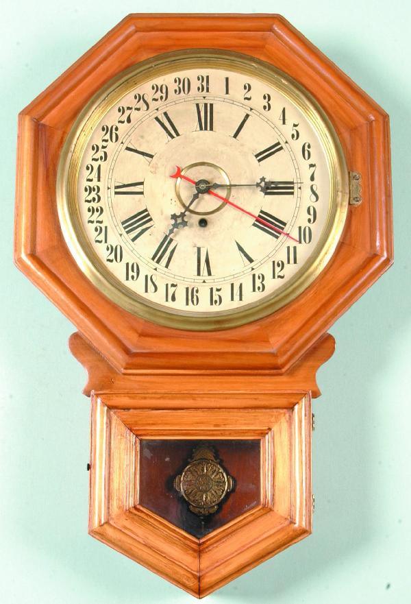 Wm. Gilbert Regulator/Calendar Clock, 8-day, runni: Wm. Gilbert Regulator/Calendar Clock, 8-day, running condition with key pendulum, paper label on back marked Admiral 26 ½"h., Condition: Good.