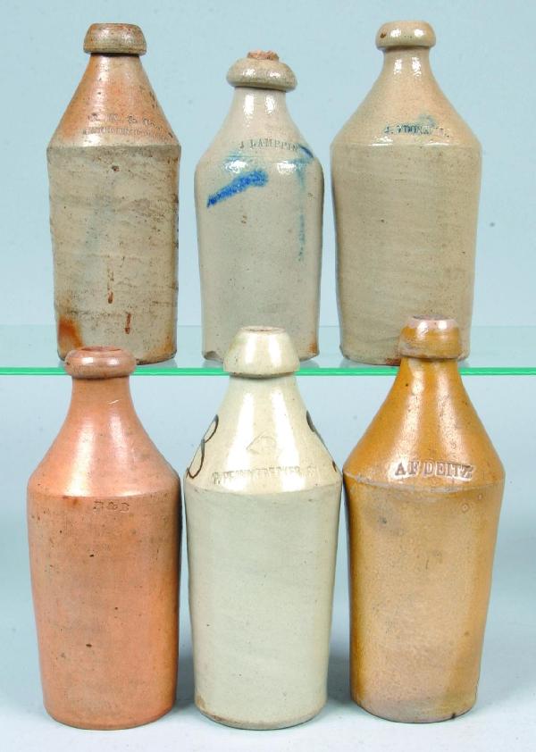 Six Stoneware Pottery Salt Glazed Beer Bottles wit: Six Stoneware Pottery Salt Glazed Beer Bottles with impressed names; J. LAMPPIN, J. O'DONNELL, B & B, P. PFANNEBECKER SR., R.K. & Co., A.F. DEITZ. 8-3/4" to 10-3/4" high. Condition: Minor chips.